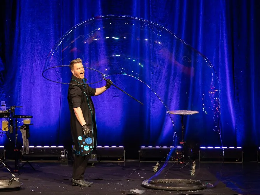 A huge bubble arcing across the stage