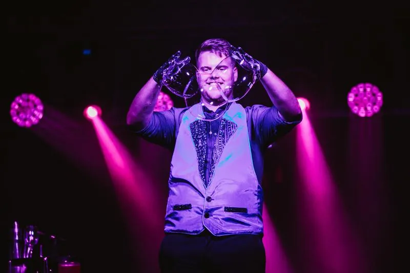 The Schizophrenic – a bubble above his head in magenta stage light